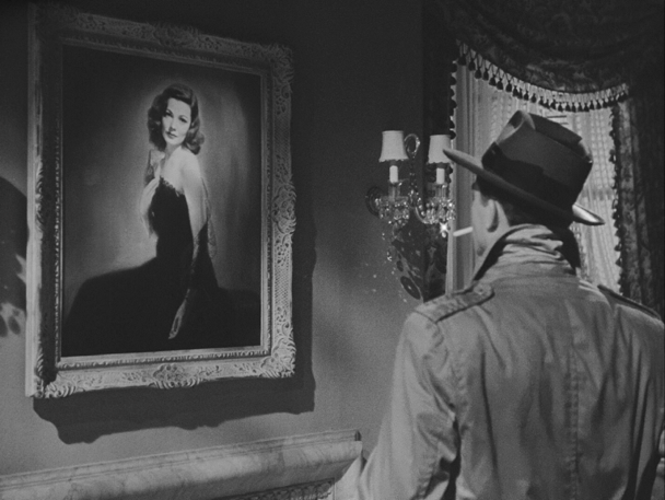 Humphrey Bogart looking at a painting of Lauren Bacall in the movie Key Largo