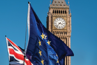 A picture of the Union Jack next to the European Union flag with Big Ben in the background