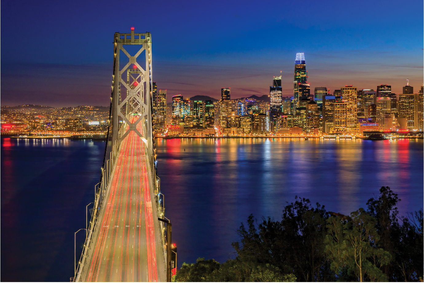 A night view of San Francisco from the view of the Bay Bridge looking west.