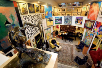 The interior of an art gallery featuring a collection of paintings