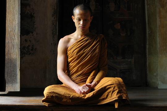 A Buddhist monk meditating