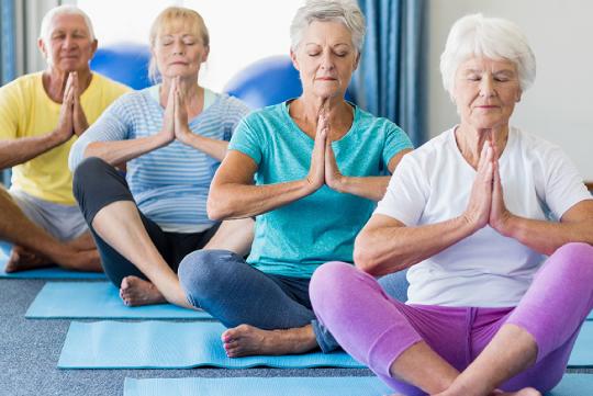 A group of women practicing yoga