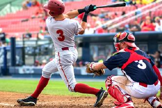 A baseball hitter at a game