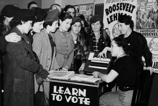 A group of women registering to vote.